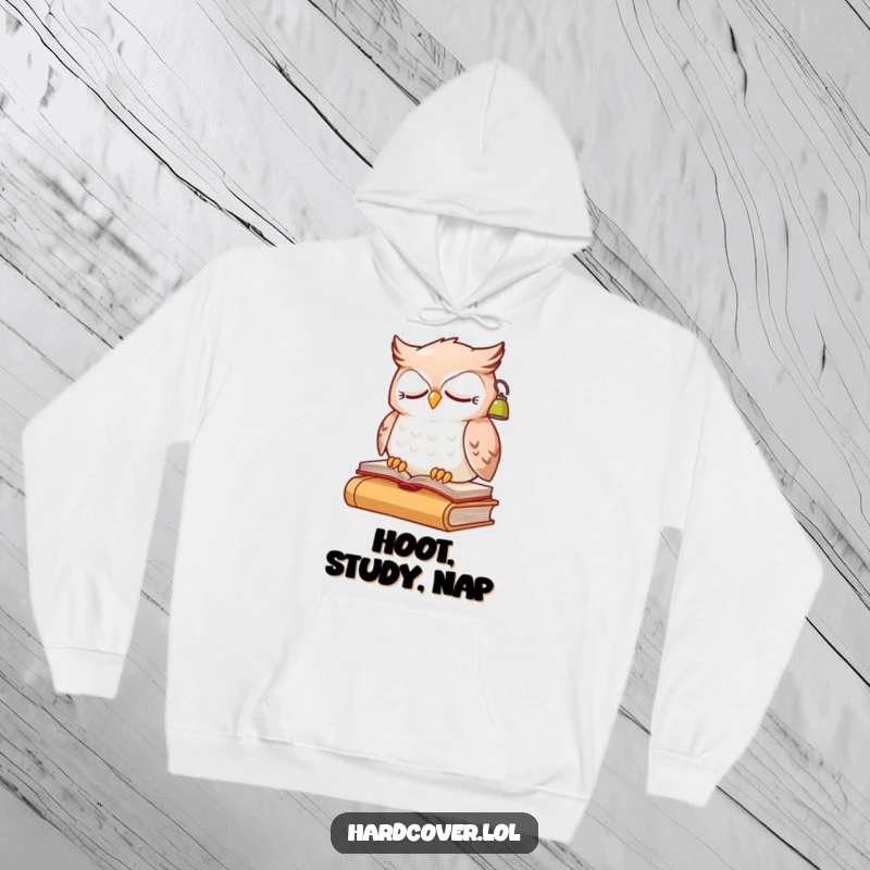 Funny sleepy owl character perched on a book, wearing a small reading lamp, on a warm hoodie.