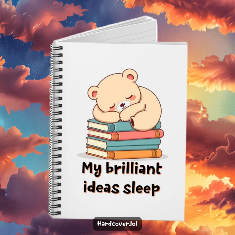 Funny sleepy bear design on a notebook cover, bear is asleep on books, inspiring cozy writing sessions.