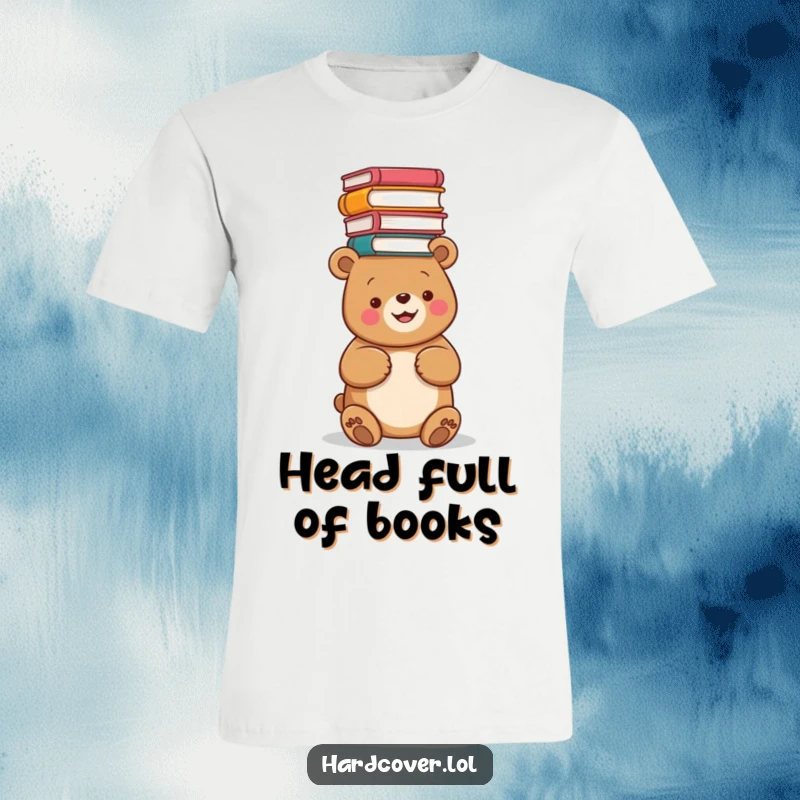 Funny t-shirt depicting a happy bear precariously balancing a tall stack of books on its head, conveying bookish joy.